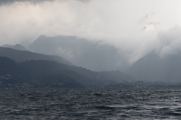 clouds and mountains on lake