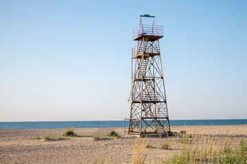  Lifeguard observation tower stands on the beach of the sea