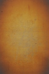 Feuerroter Hintergrund, Tieforange farbene gesteinsstruktur mit rissen und rustikalen Strukturen und abgedunkelten Ecken.