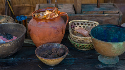 handmade dyeing of fabrics and wool in a cauldron with colored dyes in a medieval fair in Spain