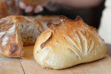 Wheat bread on wooden background, close up