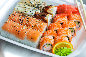 home delivery of fast food: sushi with fish and rice