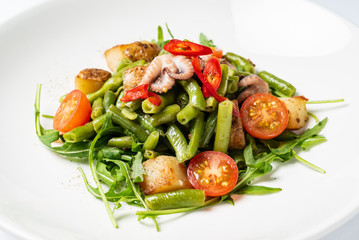 salad with baby octopus and vegetables
