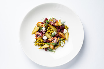 vegetable salad with beetroot on the white plate