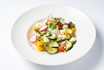 vegetable salad on the white plate