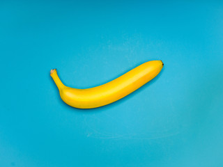 Yellow banana on blue background