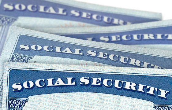 U.S. Social Security Cards In Perspective View With Shallow Depth Of Field Isolated On White Background