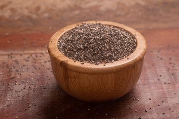 Chia seeds in a wooden bowl