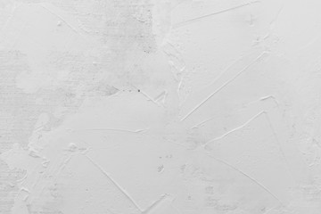 Texture of white plaster. Covering the concrete wall of the house. Rough surface. Repair and construction.