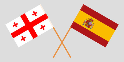 Georgia and Spain. Crossed Georgian and Spanish flags