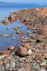 Red stone and rock formation at Storsand beach, Norfällsviken, Gulf of Bothnia, Sweden, Europe