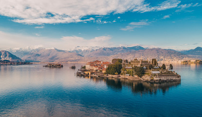 Aerial shot of the Borromean islands in a winter day with reflections in the water