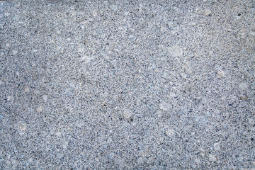 Background of polished granite white smoky color with lilac black specks. Backgrounds texture design.