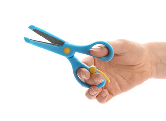 Woman holding training scissors on white background, closeup