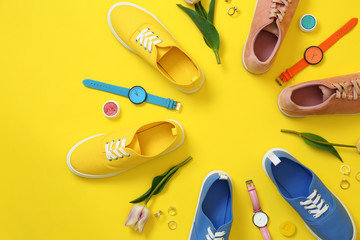 Flat lay composition with different sneakers and accessories on color background. Trendy spring look
