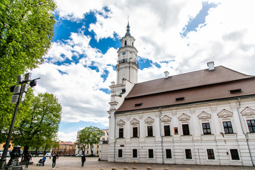 Fototapeta na wymiar Town Hall White Swan in the center of Kaunas at the Town Hall Square in Lithuania in the spring against a blue sky with cirrus clouds. Kaunas, Lithuania – May, 2019
