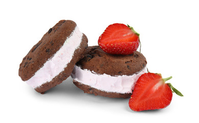 Sweet delicious ice cream cookie sandwiches and strawberry on white background