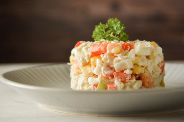 Chicken meat salad with mayonnaise and vegetables.