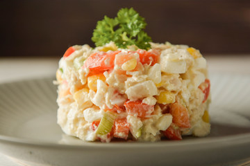 Chicken meat salad with mayonnaise and vegetables.