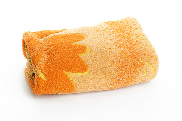 orange towels stacked on a white background