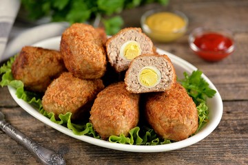 Fried meat balls with boiled quail egg inside.