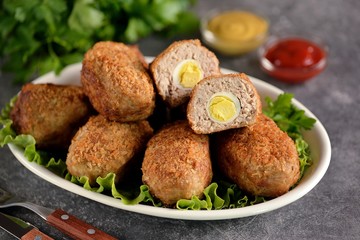 Fried meat balls with boiled quail egg inside.