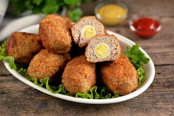 Fried meat balls with boiled quail egg inside.