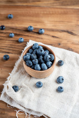 Fresh blueberries on rustic wooden table