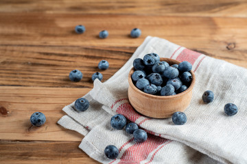 Fresh blueberries on rustic wooden table