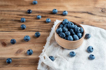 Fresh blueberries on rustic wooden table