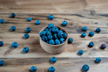 Fresh blueberries on rustic wooden table