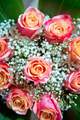 Beautiful bouquet of roses close-up . Pink and yellow mixed Rose, beautiful nature background . Artificial roses on table,Love valentine concept