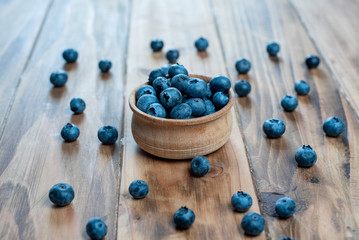 Fresh blueberries on rustic wooden table