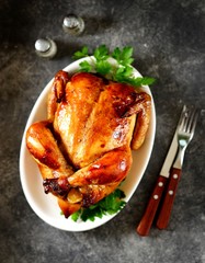 Roasted whole chicken. Delicious homemade food. Top view. Copy space. 