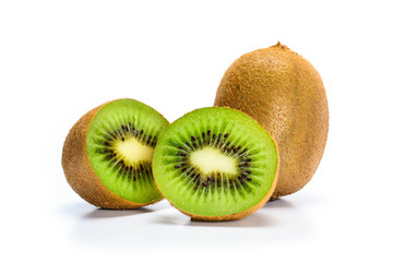 Kiwi fruit and one fruit cut in two halves, isolated on white background. Closeup macro.