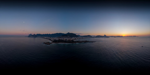 Intense colourful 360 degree aerial sunrise panorama of Arpoador cliff and wider cityscape of Rio de Janeiro ready for use in 3D environment mapping and 360VR.