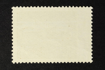 Blank vintage postage stamp on black background. Mockup with perforations for your picture text or design 2.