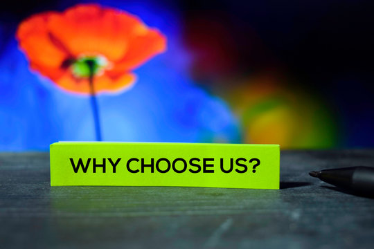 Why Choose Us? On The Sticky Notes With Bokeh Background