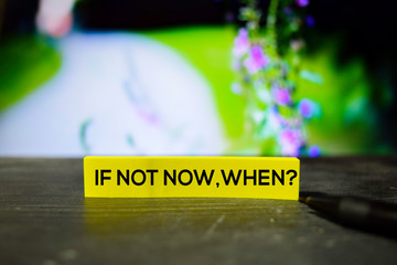 If Not Now, When? on the sticky notes with bokeh background