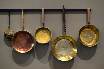 Copper cookware on gray background