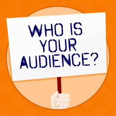 Conceptual hand writing showing Who Is Your Audience Question. Concept meaning who is watching or listening to it Hand Holding White Placard Supported for Social Awareness