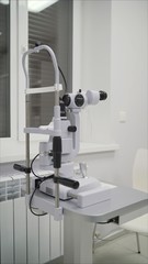 Spacious case. Tall complicated device for intense ophthalmology diagnoses made of metal and plastic Apparatus for the diagnosis of vision