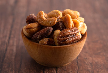 Honey Roasted Nuts on a Rustic Dark Wood Table