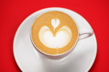 Top view of coffee cup with latte art.