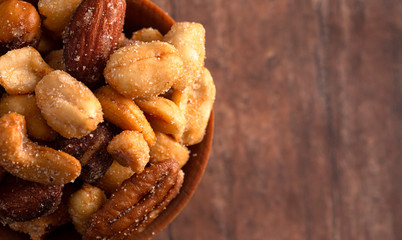 Honey Roasted Nuts on a Rustic Dark Wood Table