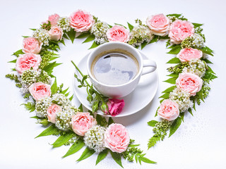 Valentine's day flower arrangement. Rose, hawthorn flowers, rowan leaves and cup coffee on a white background. Floral pattern