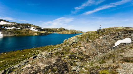 Fototapeta na wymiar Tourist enjoying landscape norwegian nature