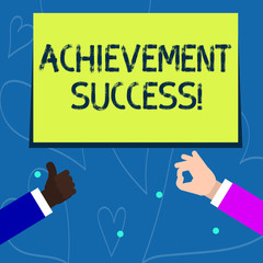Conceptual hand writing showing Achievement Success. Concept meaning status of having achieved and accomplished an aim Two Businessmen Hands Gesturing the Thumbs Up and Okay Sign