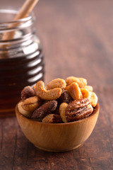 Honey Roasted Nuts on a Rustic Dark Wood Table