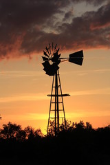 Kansas colorful Sunset with a Windmill silhouette